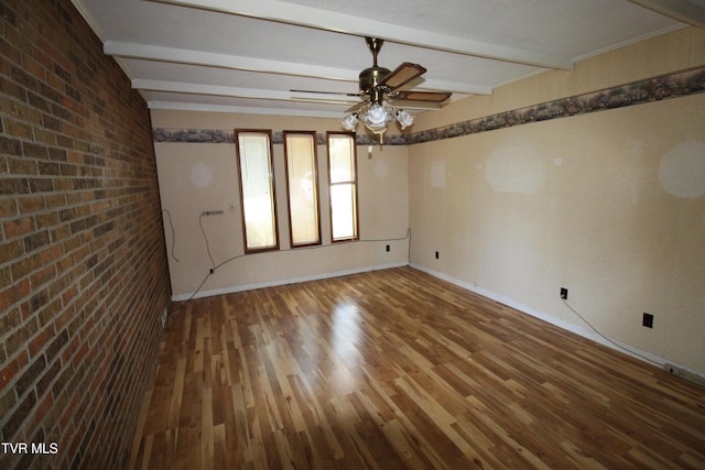 288 Hicks Rd, Piney Flats, TN 37686 - empty room featuring wood finished floors, beamed ceiling, a ceiling fan, and brick wall