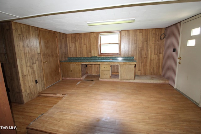 288 Hicks Rd, Piney Flats, TN 37686 - kitchen with brown cabinets, light wood-style floors, wood walls, and an office area