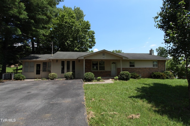 288 Hicks Rd, Piney Flats, TN 37686 - ranch-style house with a chimney, brick siding, and a front yard