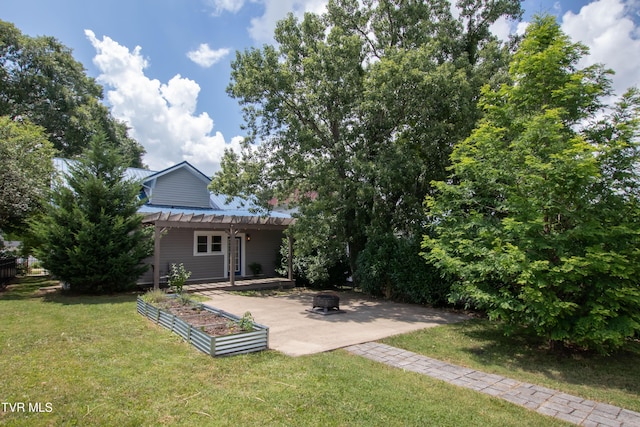 917 Pennsylvania Ave, Bristol, TN 37620 - view of green lawn with an outdoor fire pit and a patio area