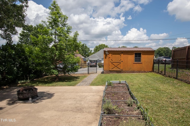 917 Pennsylvania Ave, Bristol, TN 37620 - view of yard featuring a fire pit, a garden, and a storage unit