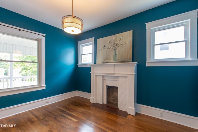 917 Pennsylvania Ave, Bristol, TN 37620 - unfurnished living room featuring a fireplace and wood finished floors