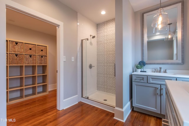917 Pennsylvania Ave, Bristol, TN 37620 - bathroom featuring vanity, a stall shower, and wood finished floors