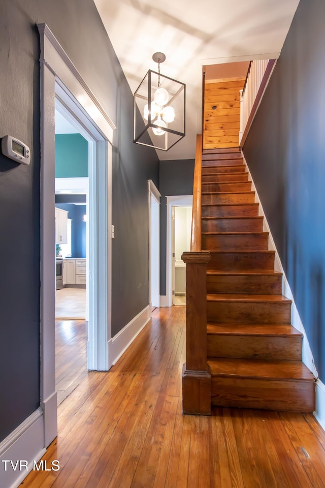 917 Pennsylvania Ave, Bristol, TN 37620 - staircase with wood-type flooring and a chandelier