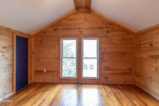 917 Pennsylvania Ave, Bristol, TN 37620 - additional living space with vaulted ceiling, light wood-style floors, and wooden walls