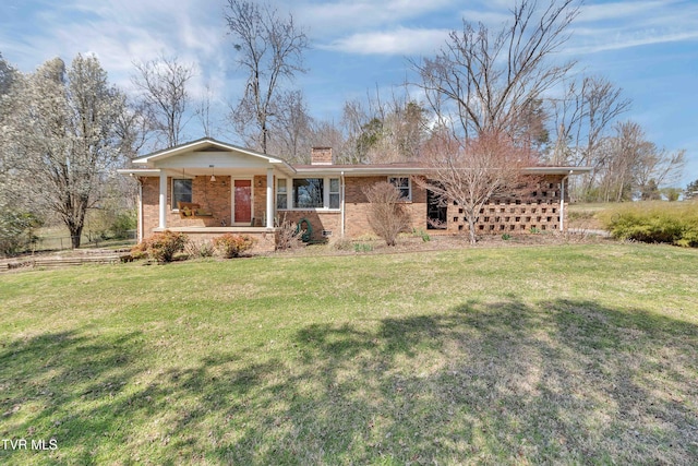 473 Oak Grove Rd, Gray, TN 37615 - single story home featuring brick siding, a front lawn, a chimney, and covered porch