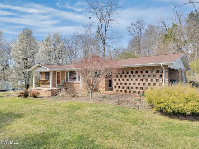 473 Oak Grove Rd, Gray, TN 37615 - view of front facade with covered porch, brick siding, a front lawn, and a shingled roof