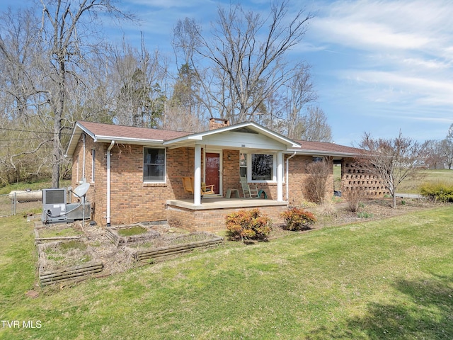 473 Oak Grove Rd, Gray, TN 37615 - ranch-style house with brick siding, covered porch, a front yard, and a chimney