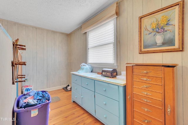 473 Oak Grove Rd, Gray, TN 37615 - bedroom with light wood-style flooring, a textured ceiling, and wooden walls