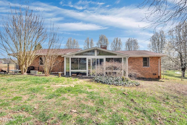 473 Oak Grove Rd, Gray, TN 37615 - rear view of house featuring brick siding, a sunroom, and a chimney
