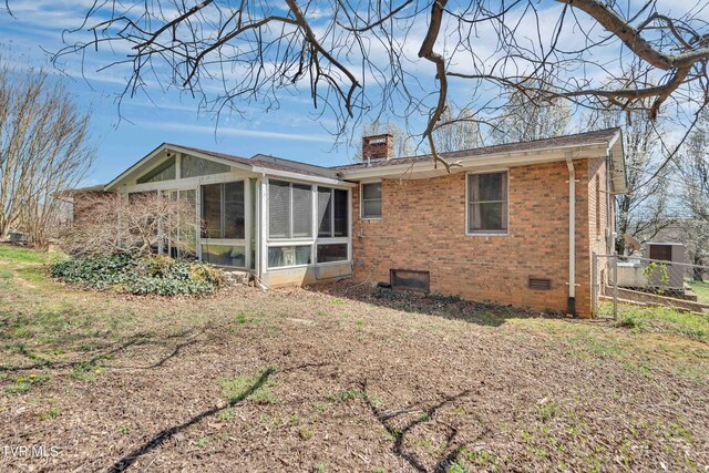 473 Oak Grove Rd, Gray, TN 37615 - back of property featuring brick siding, crawl space, a sunroom, and a chimney