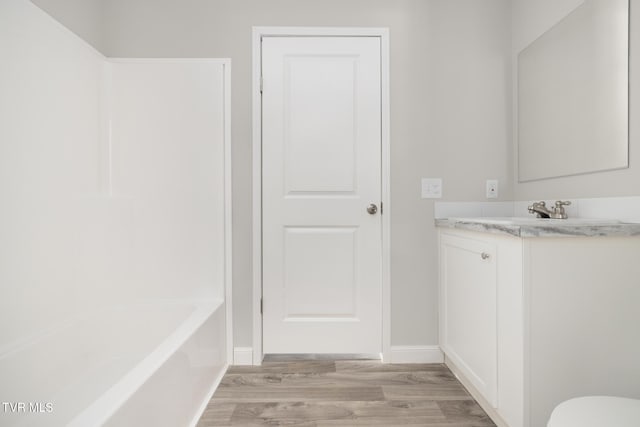 1024 Walnut Ave, Kingsport, TN 37660 - full bathroom with wood finished floors, vanity, and bathtub / shower combination