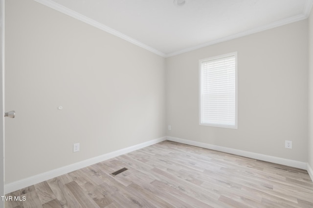 1024 Walnut Ave, Kingsport, TN 37660 - unfurnished room featuring ornamental molding and light wood-style flooring
