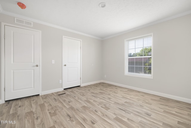 1024 Walnut Ave, Kingsport, TN 37660 - unfurnished bedroom with ornamental molding and light wood finished floors