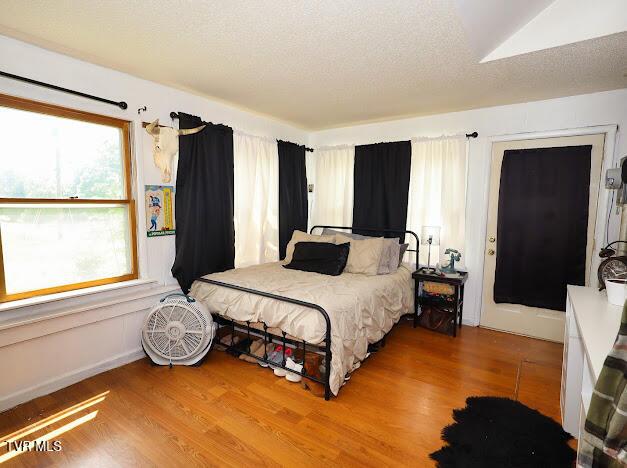8087 Baptist Valley Rd, North Tazewell, VA 24630 - bedroom featuring wood finished floors