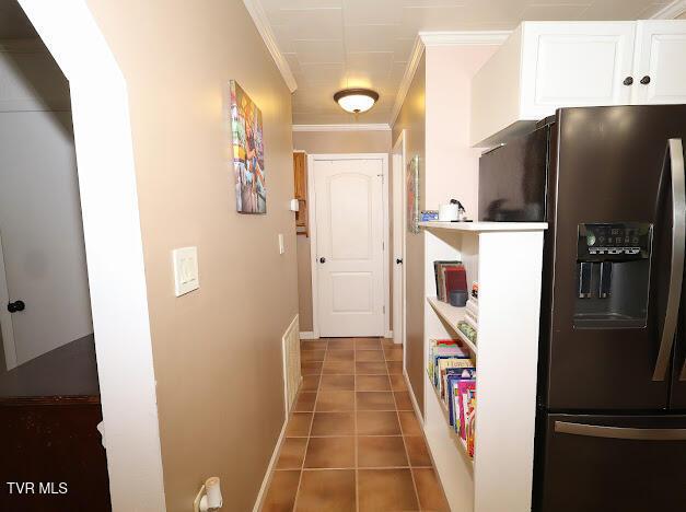 8087 Baptist Valley Rd, North Tazewell, VA 24630 - hallway with crown molding and light tile patterned flooring
