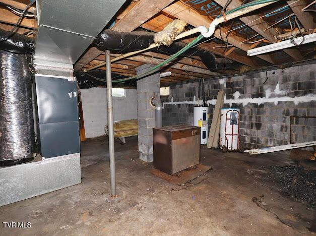 8087 Baptist Valley Rd, North Tazewell, VA 24630 - unfinished basement with electric water heater, concrete block wall, and heating unit