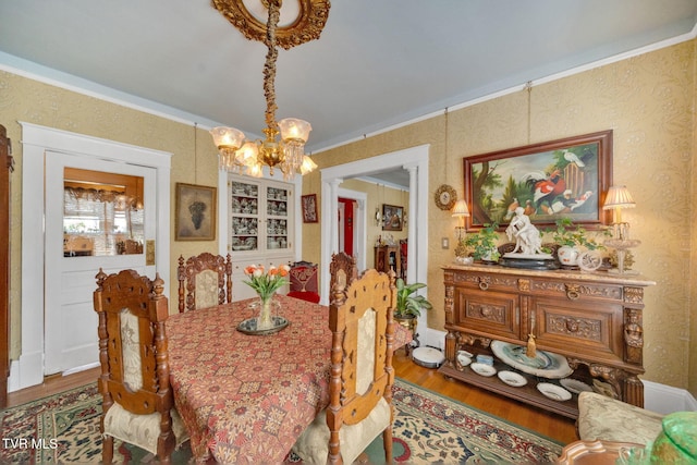 201 W Wanola Ave, Kingsport, TN 37660 - dining space with wood finished floors, a chandelier, and wallpapered walls
