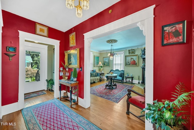 201 W Wanola Ave, Kingsport, TN 37660 - entryway featuring a chandelier, wood finished floors, and ornamental molding