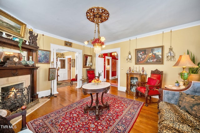 201 W Wanola Ave, Kingsport, TN 37660 - living area with a fireplace, wood finished floors, and ornamental molding