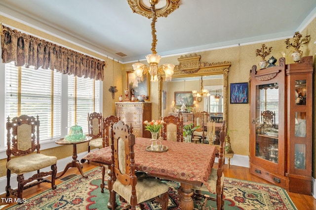 201 W Wanola Ave, Kingsport, TN 37660 - dining room featuring a chandelier, wood finished floors, and ornamental molding