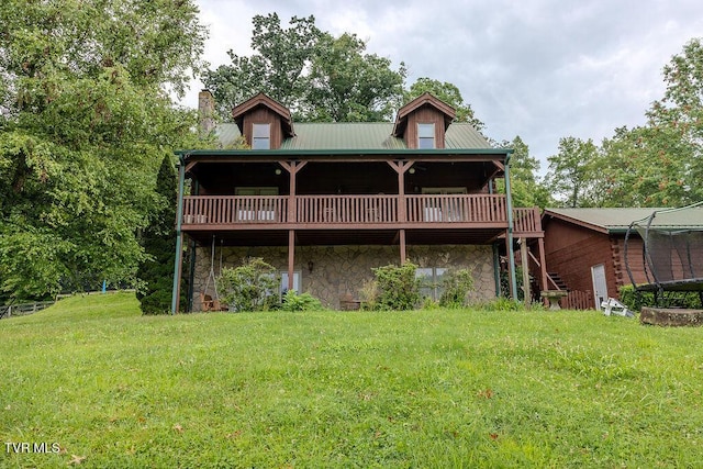 332 Undertaker Blvd, Clintwood, VA 24228 - rear view of property featuring stone siding, a wooden deck, a chimney, and a lawn