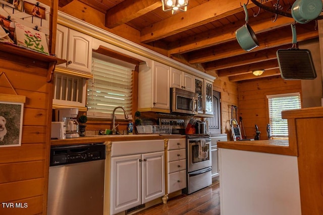 332 Undertaker Blvd, Clintwood, VA 24228 - kitchen featuring stainless steel appliances, wooden counters, a wooden ceiling with exposed beams, dark wood-style flooring, and wood walls