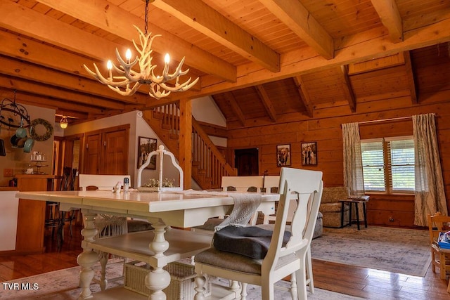 332 Undertaker Blvd, Clintwood, VA 24228 - dining room with wood ceiling, hardwood / wood-style flooring, a chandelier, wooden walls, and stairs