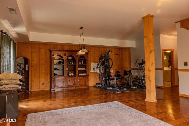 332 Undertaker Blvd, Clintwood, VA 24228 - dining space with wood finished floors, wooden walls, arched walkways, and ornate columns