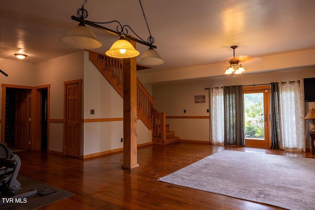 332 Undertaker Blvd, Clintwood, VA 24228 - unfurnished living room with stairway, wood finished floors, and a ceiling fan
