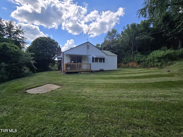 1358 Bristol Hwy, Elizabethton, TN 37643 - back of house featuring a deck and a lawn
