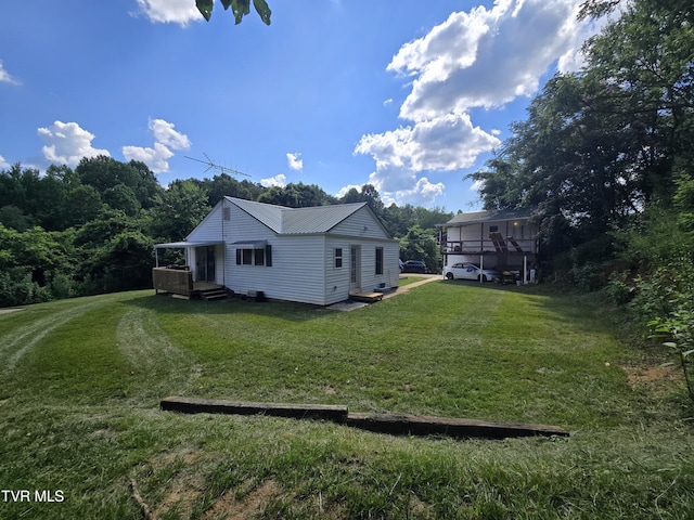 1358 Bristol Hwy, Elizabethton, TN 37643 - view of property exterior with a lawn and a metal roof
