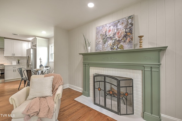 1091 Long Crescent Dr, Bristol, VA 24201 - living room with light wood-style floors, a brick fireplace, and recessed lighting