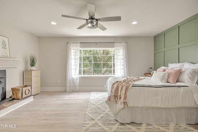1091 Long Crescent Dr, Bristol, VA 24201 - bedroom with light wood-style flooring, recessed lighting, a fireplace, and a ceiling fan