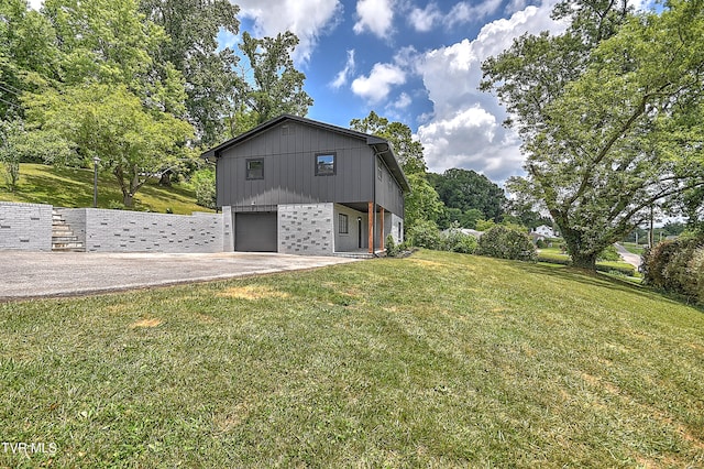 1091 Long Crescent Dr, Bristol, VA 24201 - view of home's exterior with a garage, a yard, brick siding, and driveway