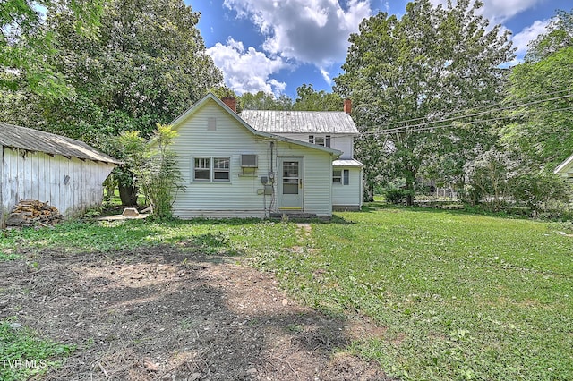 301 Keenburg Rd, Bluff City, TN 37618 - back of house with a lawn, a chimney, and a metal roof