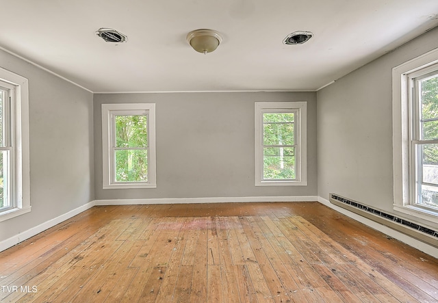 301 Keenburg Rd, Bluff City, TN 37618 - empty room featuring hardwood / wood-style flooring, plenty of natural light, and a baseboard radiator