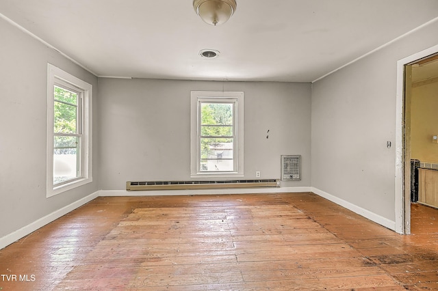 301 Keenburg Rd, Bluff City, TN 37618 - spare room featuring plenty of natural light, baseboard heating, and hardwood / wood-style flooring