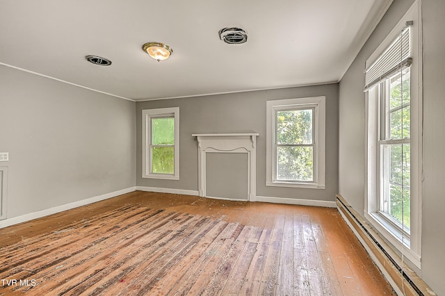 301 Keenburg Rd, Bluff City, TN 37618 - unfurnished living room with a baseboard radiator, healthy amount of natural light, and hardwood / wood-style floors