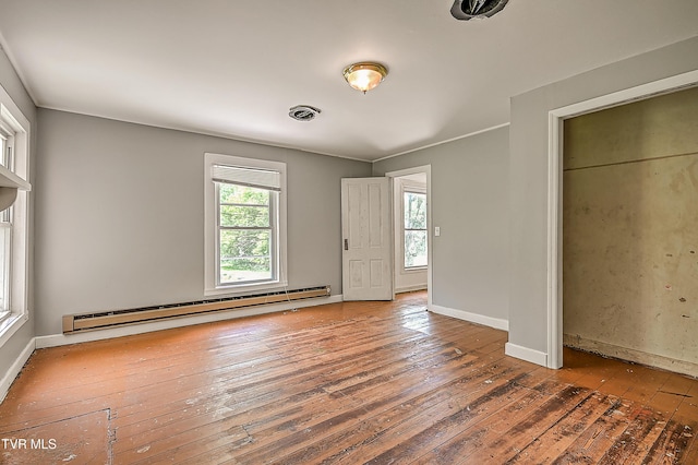 301 Keenburg Rd, Bluff City, TN 37618 - unfurnished bedroom with baseboard heating and hardwood / wood-style floors