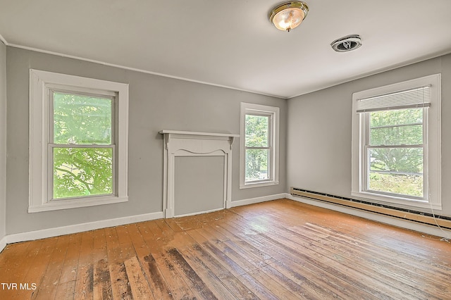 301 Keenburg Rd, Bluff City, TN 37618 - unfurnished living room featuring a baseboard radiator, healthy amount of natural light, and hardwood / wood-style floors