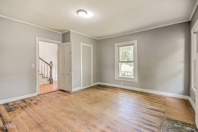 301 Keenburg Rd, Bluff City, TN 37618 - unfurnished room featuring light wood-style floors, ornamental molding, and stairs