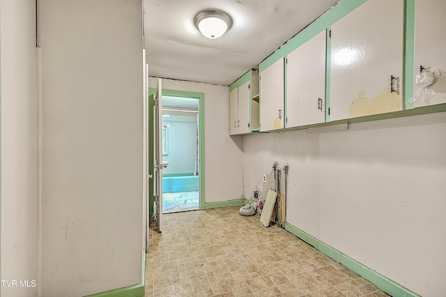 301 Keenburg Rd, Bluff City, TN 37618 - laundry room with cabinet space and baseboards