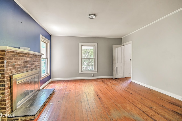 301 Keenburg Rd, Bluff City, TN 37618 - unfurnished living room featuring a fireplace, wood-type flooring, and crown molding