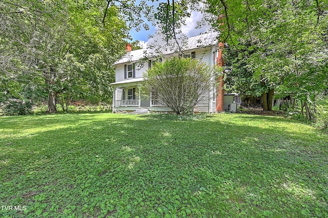 301 Keenburg Rd, Bluff City, TN 37618 - back of property featuring a yard and a chimney