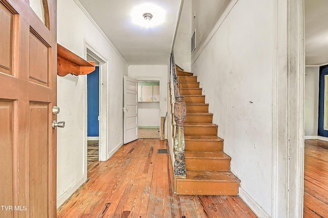 301 Keenburg Rd, Bluff City, TN 37618 - entrance foyer with light wood finished floors, stairs, and crown molding