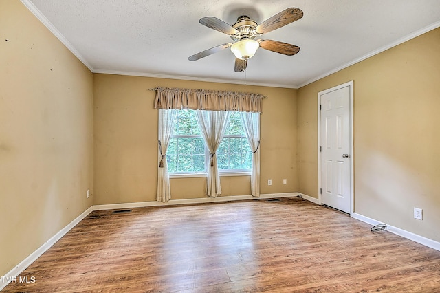 13275 Chip Ridge Rd, Abingdon, VA 24210 - spare room with wood finished floors, a ceiling fan, crown molding, and a textured ceiling