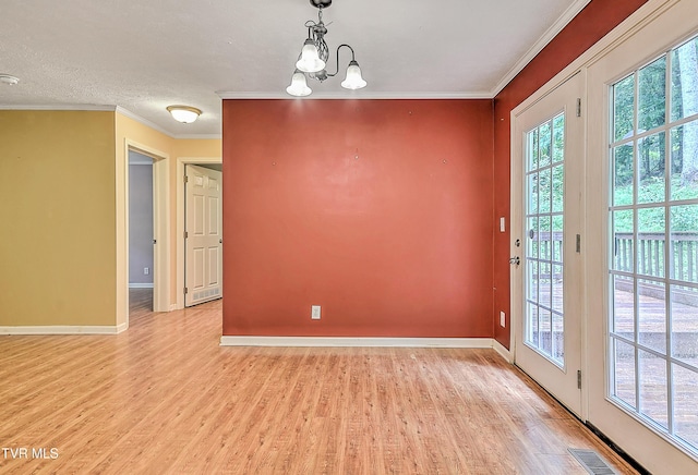 13275 Chip Ridge Rd, Abingdon, VA 24210 - unfurnished dining area with plenty of natural light, light wood finished floors, a chandelier, and ornamental molding