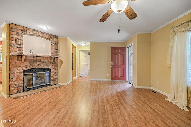 13275 Chip Ridge Rd, Abingdon, VA 24210 - unfurnished living room with light wood-style floors, a fireplace, crown molding, a ceiling fan, and a textured ceiling