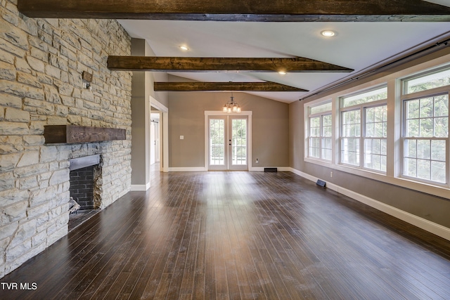 2 Longview Ln, Kingsport, TN 37660 - unfurnished living room with dark wood-style floors, a stone fireplace, and french doors